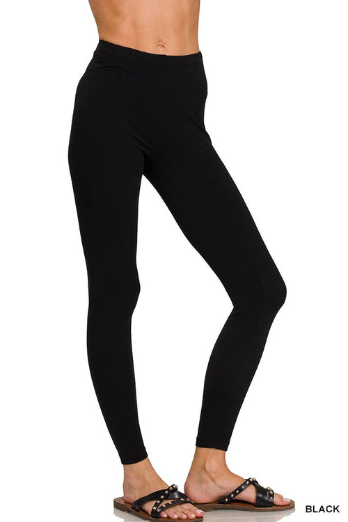Black leggings worn by a person on a white background