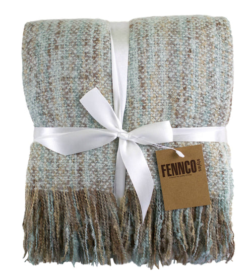 Woven blanket with fringes and a white ribbon, branded 'FENCO'.