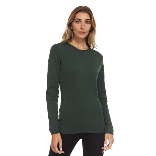 A woman modeling a dark forest green long-sleeve crewneck knit top against a plain white background.