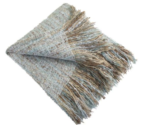 Woven blanket with fringes on a white background