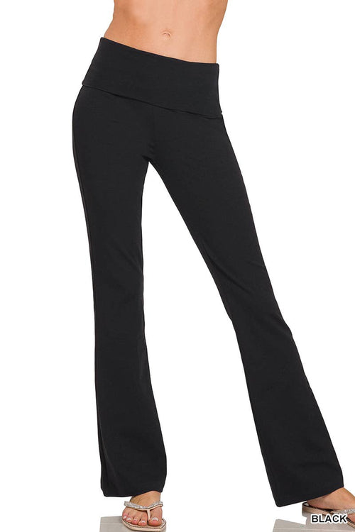 Black high-waisted maternity flare pants shown on a model from the waist down, featuring a wide elastic waistband and a flared leg, against a plain white background.