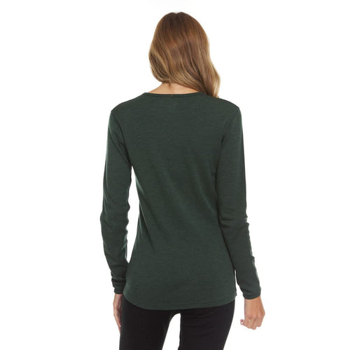 Woman wearing a green long-sleeve shirt on a white background