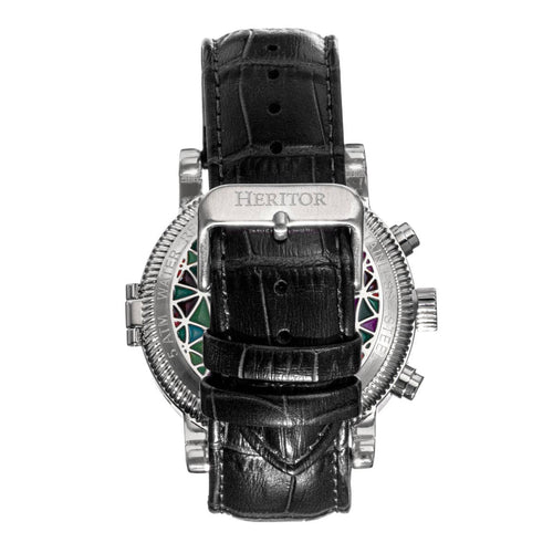 Luxury watch with black leather strap and intricate design on a white background