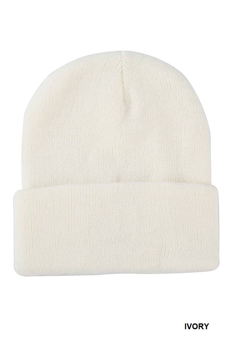 An ivory knit beanie hat with a folded cuff, shown against a plain white background with the word 'IVORY' printed in the bottom right corner.