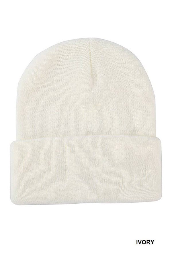 An ivory knit beanie hat with a folded cuff, shown against a plain white background with the word 'IVORY' printed in the bottom right corner.