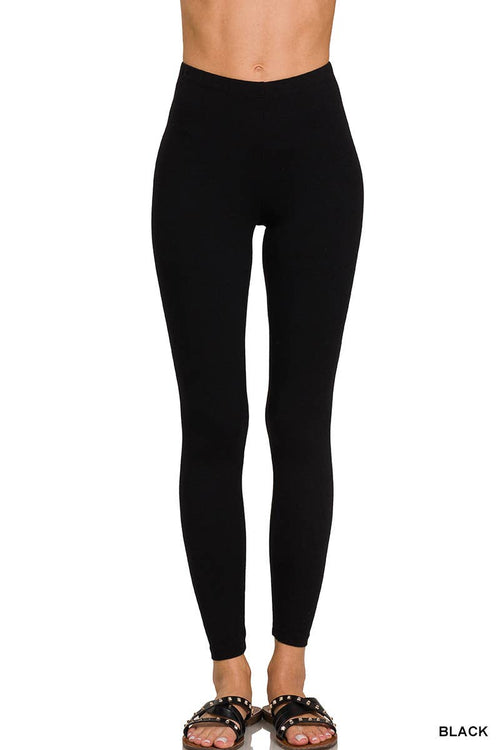 Black leggings worn by a person on a white background