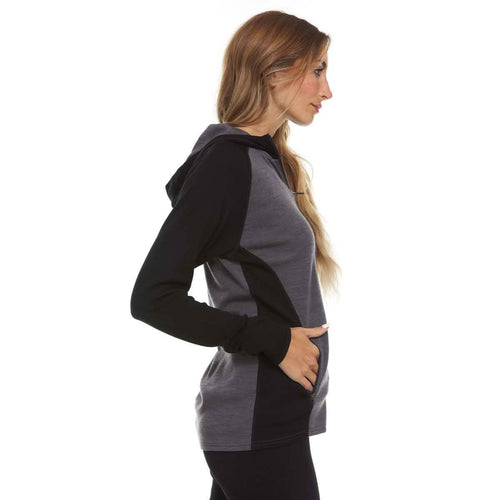 Woman wearing a black and gray hoodie on a white background