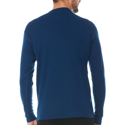 Blue long-sleeve shirt worn by a person on a white background