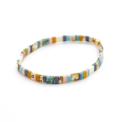 Multicolored beaded bracelet on a white background