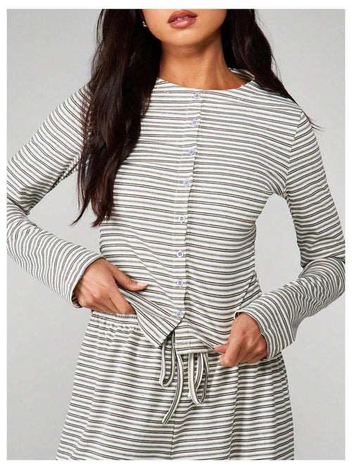 Woman wearing a striped dress with a gray background