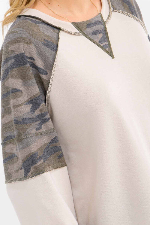 Sweatshirt with camouflage sleeves on a white background