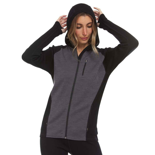 Woman wearing a black and gray zip-up hoodie on a white background