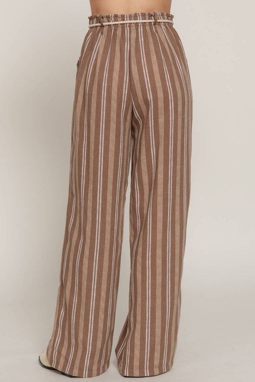 Brown and white striped pants on a plain background