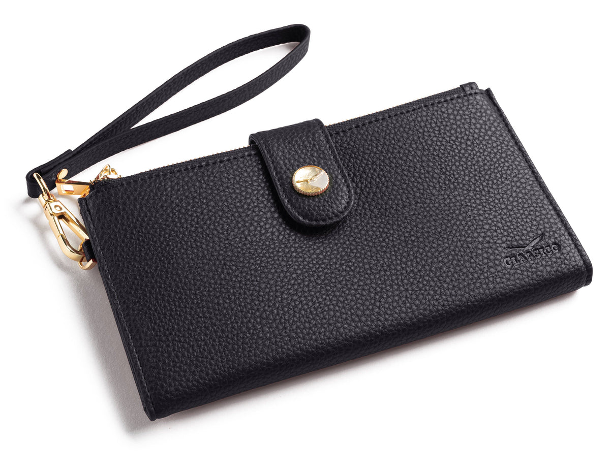Black pebbled leather wristlet clutch with a wrist strap, gold-tone hardware, and a snap-button closure on a white background.