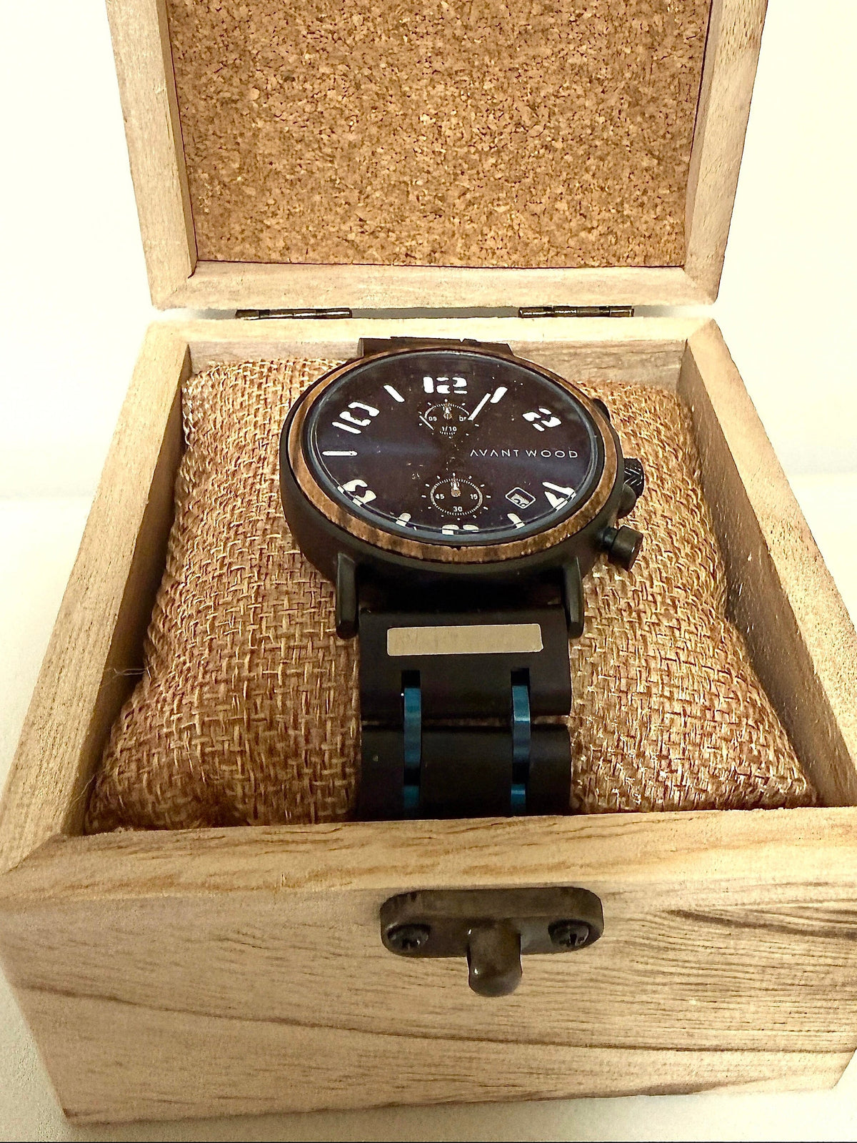Wooden watch box with a wooden watch inside