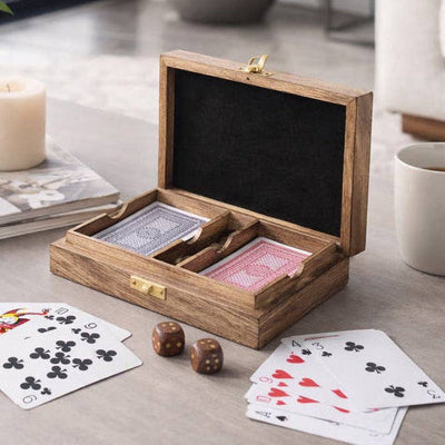  Card Game Sets Wooden playing card set with cards and dice on a table in a living room setting.