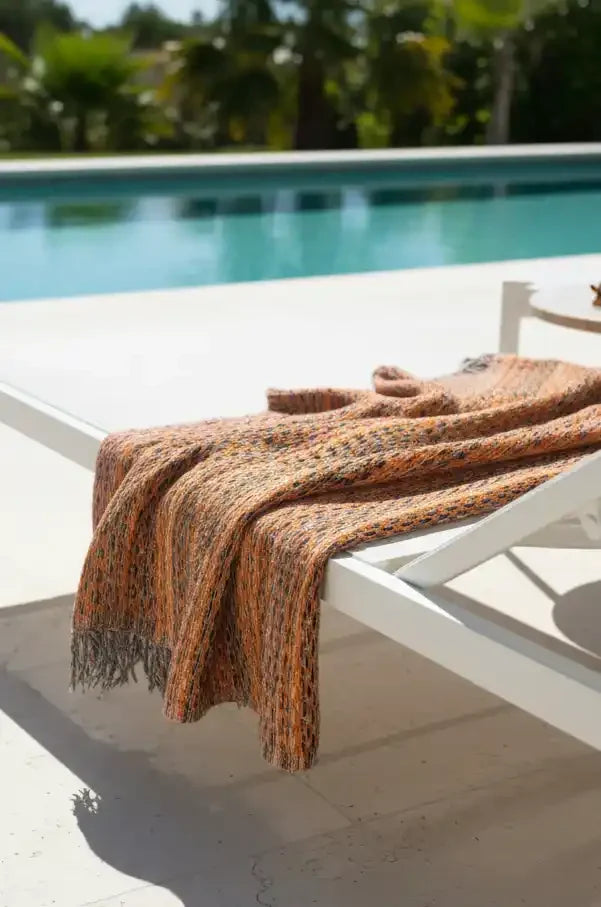 Close-up of a textured fabric with orange and black pattern