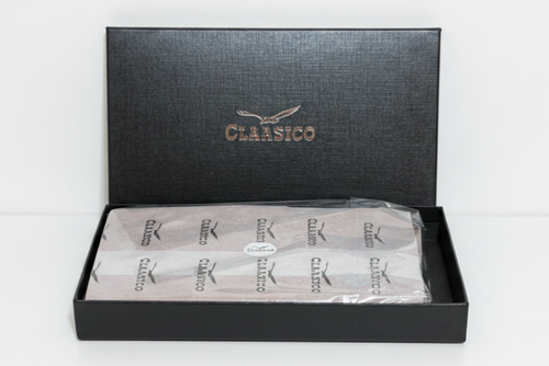A black textured CLASSICO Gift Box with its lid propped open.