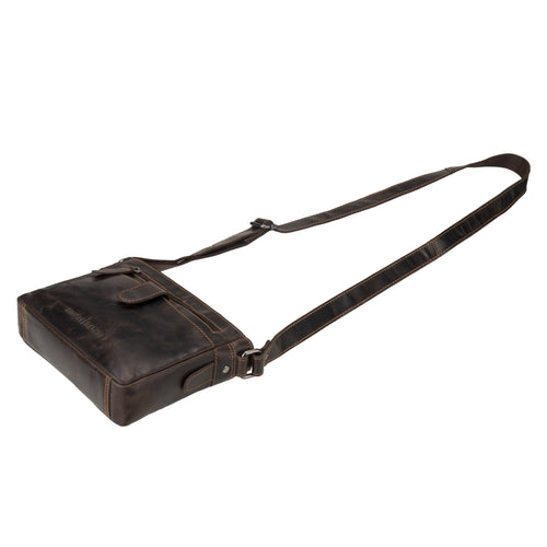 Brown leather bag with a strap on a white background