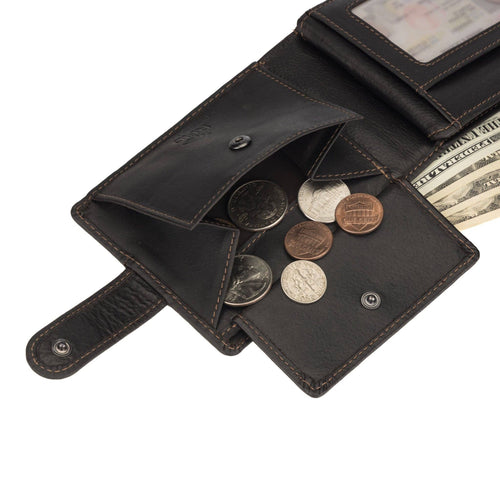 Open black leather wallet with coins and money on a white background