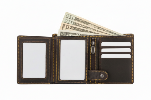 An open dark brown leather wallet with tan contrast stitching, shown on a white background with two ID slots, card slots, a zipper pocket, and several US dollar bills partially visible.
