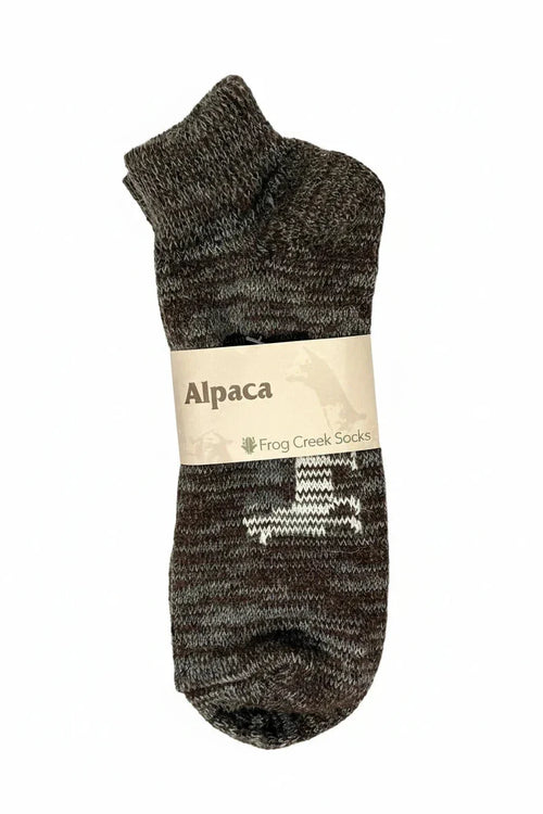 Alpaca socks with white pattern, labeled Frog Creek Socks, on white background
