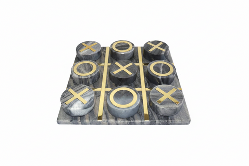 Family Game Sets A marble tic-tac-toe game set with a rectangular gray and white marbled board and nine matching round pieces, each marked with a polished gold-tone 'X' or 'O'.