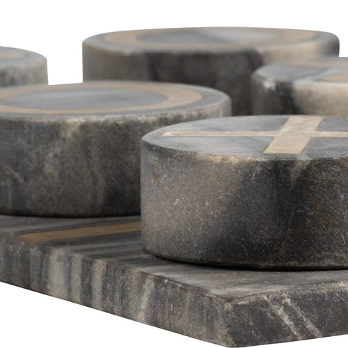 Dark gray stone  game pieces with light beige inlay details, shown in a close-up studio shot against a white background.