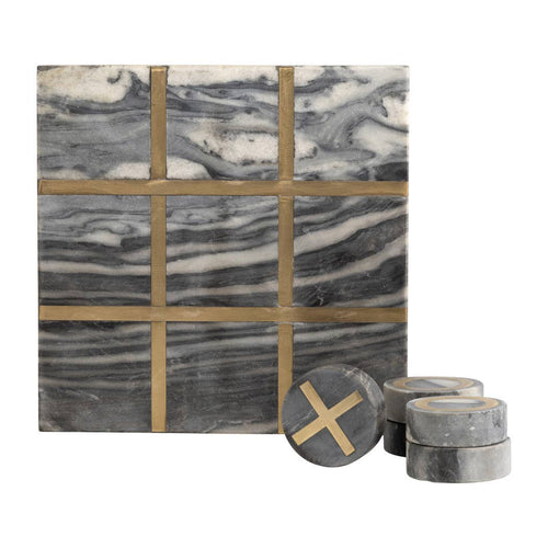 A square marble tic-tac-toe board with gray, white, and black veining, accented by gold-colored lines forming a 3x3 grid. Three round marble tokens are displayed in front, with one showing a gold 'X' mark.