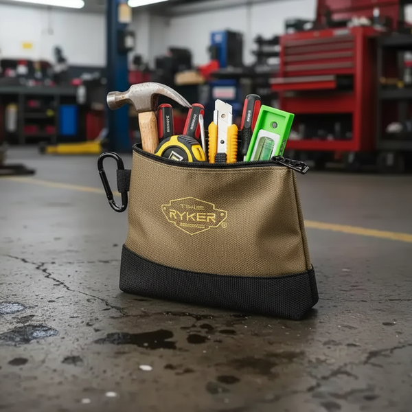 Tan and black Ryker tool pouch filled with pliers, screwdrivers, and tools in a garage workshop