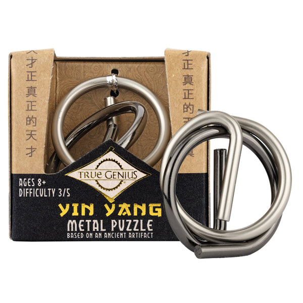 Yin Yang metal puzzle with packaging on a white background