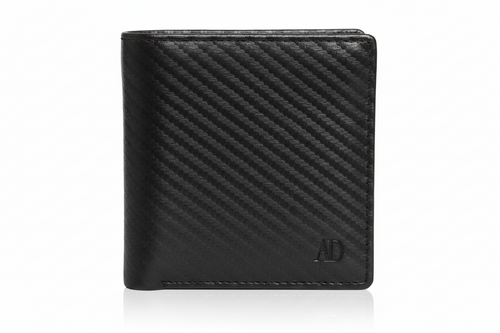 A black leather bifold wallet with a textured diagonal carbon-fiber-like pattern and a small debossed 'AD' logo in the bottom right corner, shown on a white background with a soft reflection.