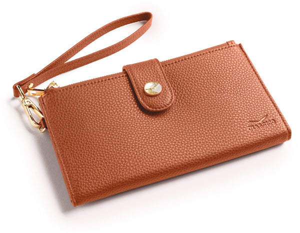 A brown pebbled leather wristlet clutch with a matching wrist strap, gold-tone hardware, and a snap-button closure, shown on a white background.