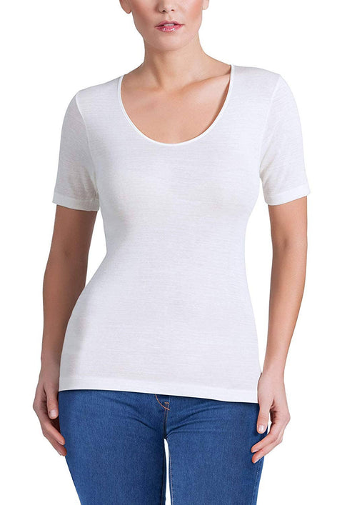 Woman wearing a plain white t-shirt and blue jeans on a white background