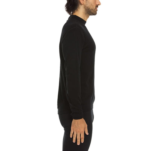 Man wearing a black long-sleeve shirt on a white background