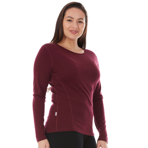 Woman wearing a maroon long-sleeve shirt on a white background