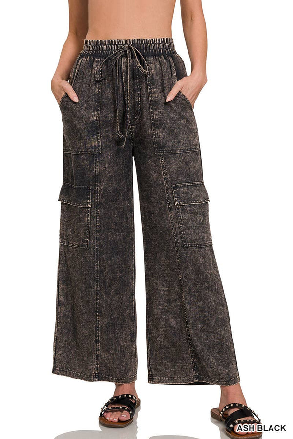 Wide-leg denim pants with a drawstring waist on a white background