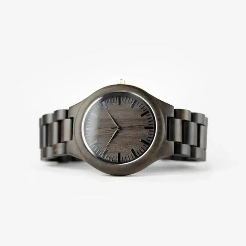 Dark wood grain watch with minimalist black dial and linked band on white background