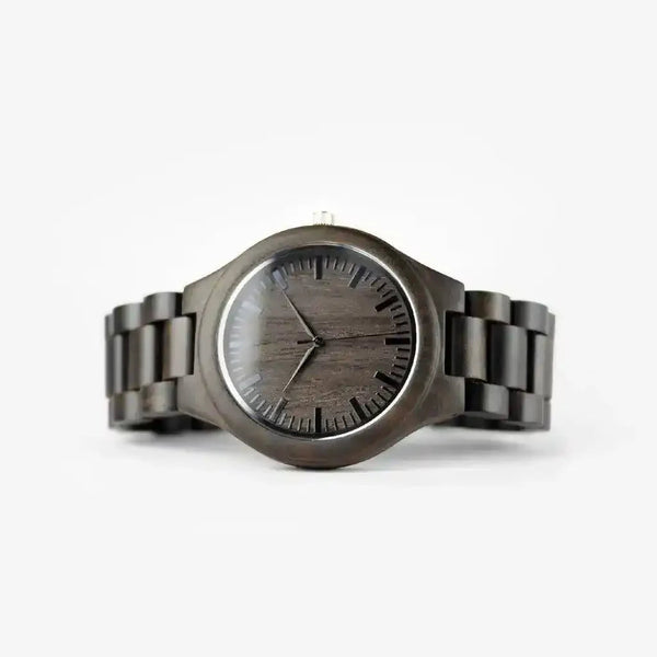 Dark wood grain watch with minimalist black dial and linked band on white background