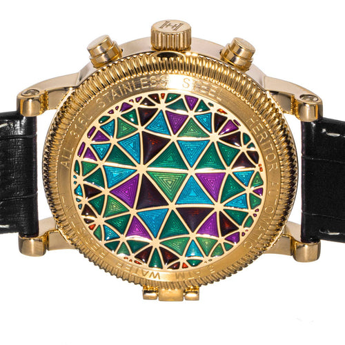 Luxury watch with gold case and colorful geometric dial on a white background