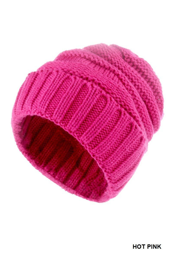 A hot pink ribbed knit beanie hat on a plain white background, with 'HOT PINK' text in the bottom right corner.