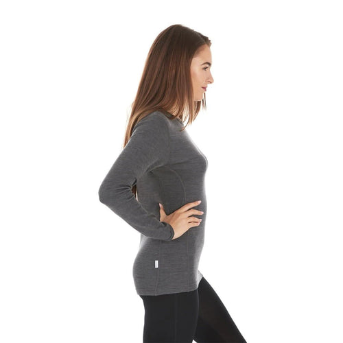Woman wearing a gray sweater on a white background