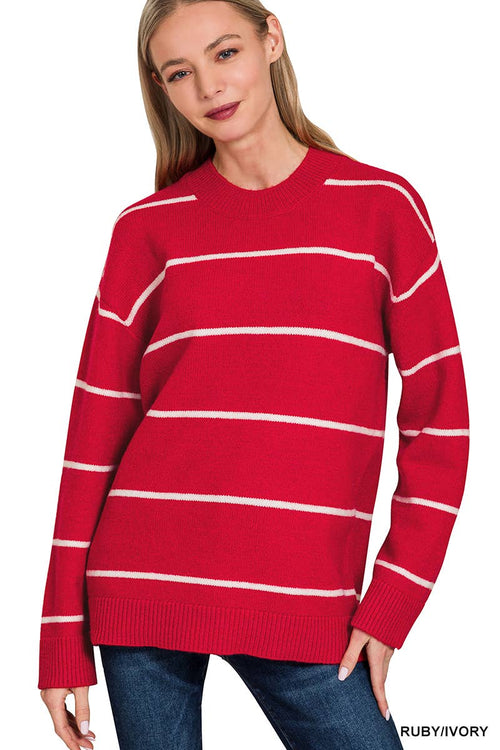 Woman wearing a red and white striped sweater on a white background